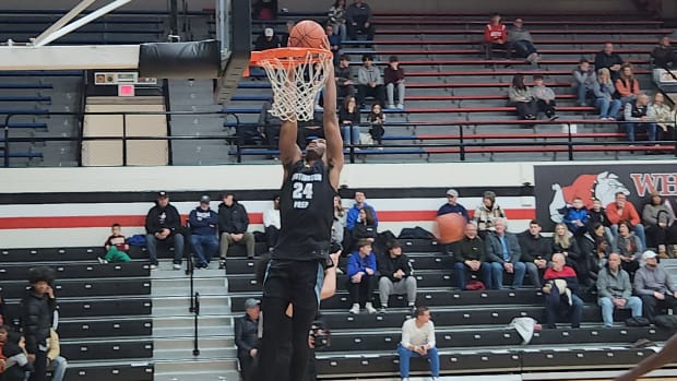 Darryn Peterson of Huntington Prep dunks in warmups before a game against Richmond Heights on February 17, 2024